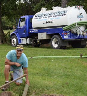 Mickey pumping a septic tank